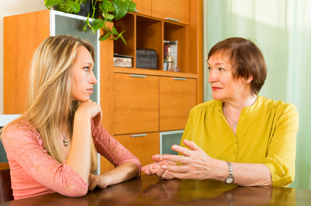 mother with daughter talking seriously